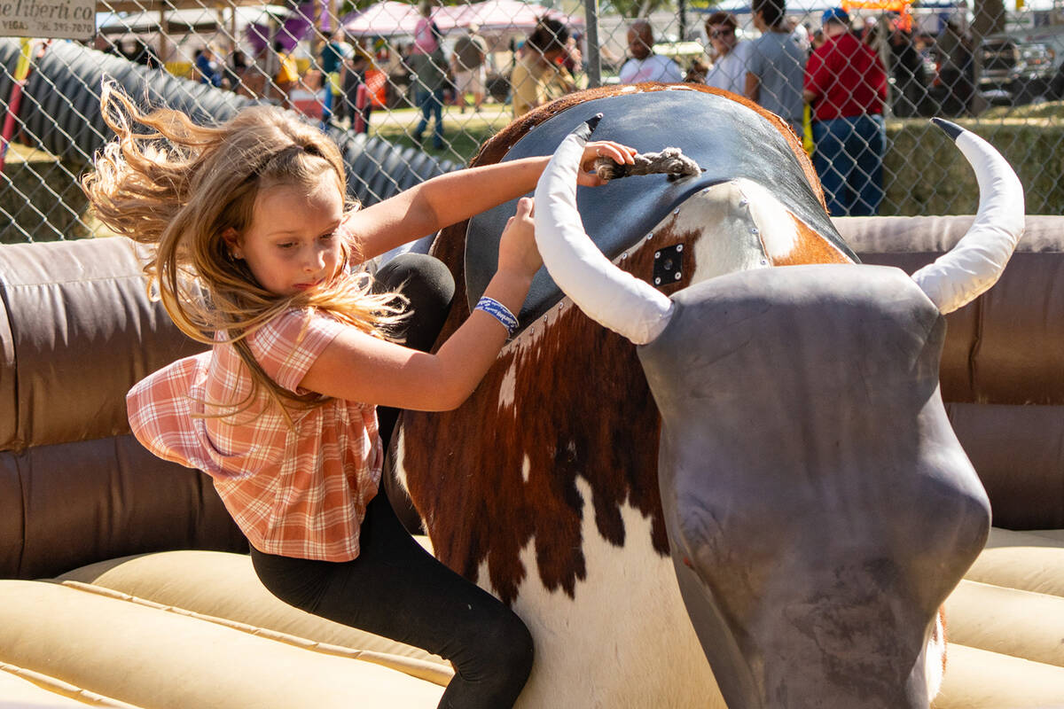 John Clausen/Pahrump Valley Times The mechanical bull was put through its paces at Pumpkin Days ...