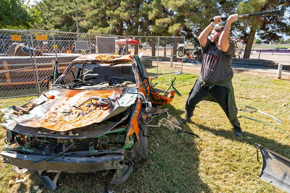 John Clausen/Pahrump Valley Times The car smash let Pumpkin Days patrons to unleash their inner ...