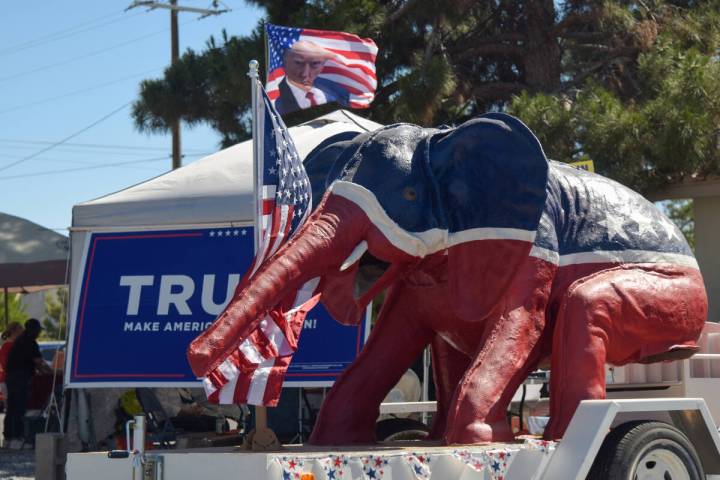 A GOP elephant on a trailer and tents display flags for the primary election held at the Bob Ru ...