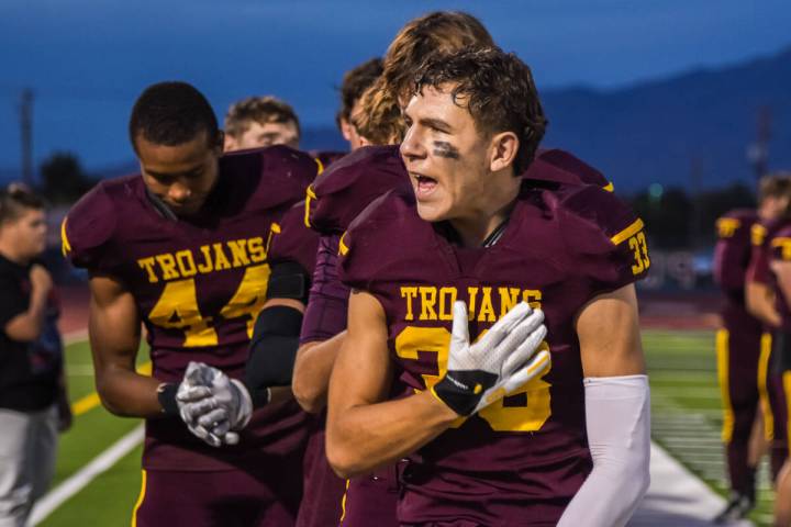 Trojans Austin Alvarez (33) (center) shouts "Let's go!" after the national anthem bef ...