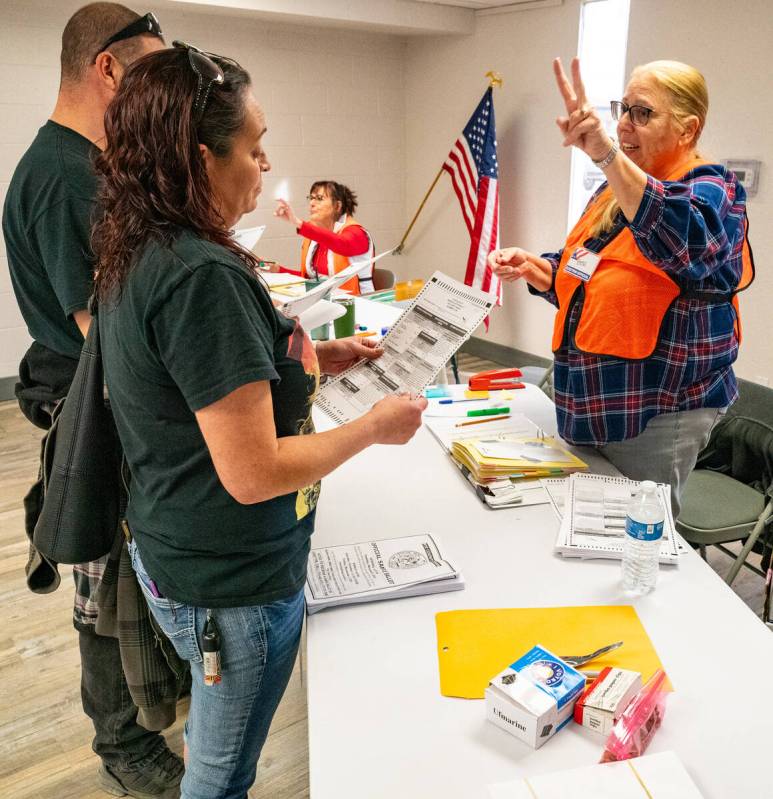 John Clausen/Pahrump Valley Times Nye County residents check in to vote at the Bob Ruud Communi ...