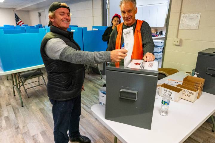 John Clausen/Pahrump Valley Times A Nye County voter submits his paper ballot at the Bob Ruud C ...