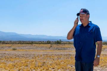 Spaceport CEO Rob Lauer makes a call while out on the empty land he plans to build on outside o ...