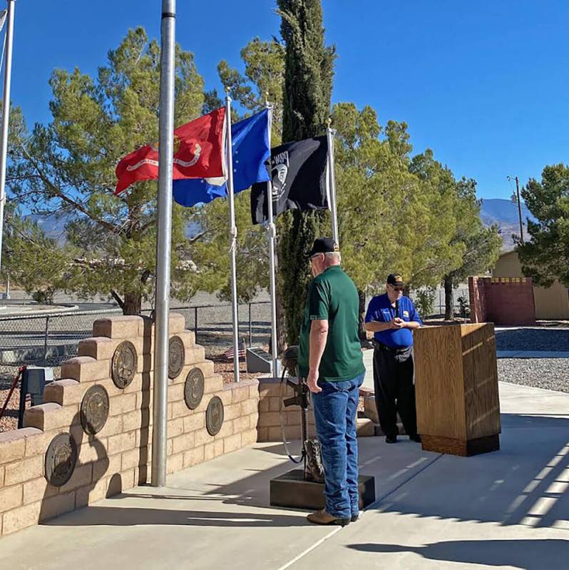 Robin Hebrock/Pahrump Valley Times Bruce Cox salutes after placing the military Dog Tag upon th ...