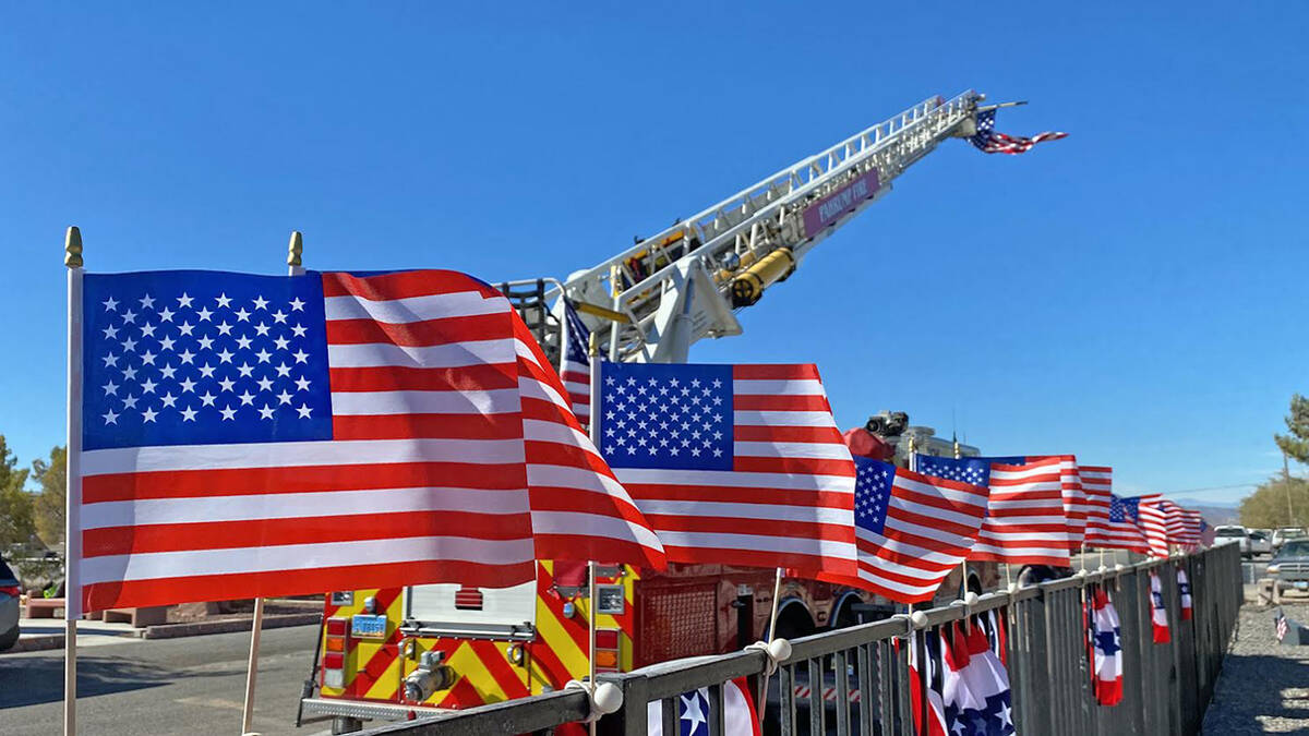 Robin Hebrock/Pahrump Valley Times A line of American Flags fluttering in the breeze greeted at ...