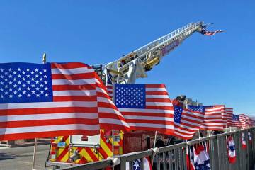 Robin Hebrock/Pahrump Valley Times A line of American Flags fluttering in the breeze greeted at ...