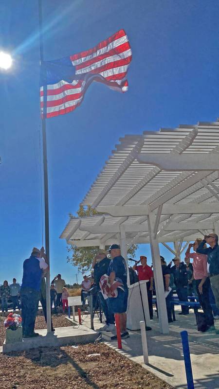 Robin Hebrock/Pahrump Valley Times VFW officials conduct a renewal of the colors, replacing the ...