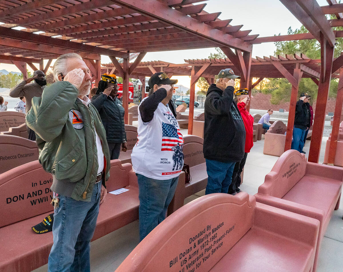 John Clausen/Pahrump Valley Times Showing the proper respect due to the moment, attendees of th ...