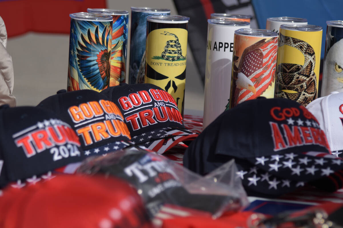 A table with Trump merchandise outside of the Bob Ruud community on Election Day Tuesday, Nov. ...