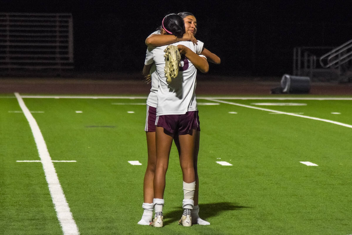 Trojans Valery Romero (3) hugs her teammate after Virgin Valley defeated Pahrump Valley, elimin ...