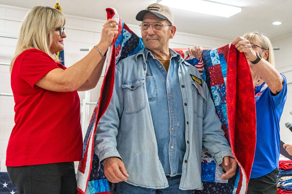 John Clausen/Pahrump Valley Times With a humble smile of thanks, an area veteran receives his Q ...