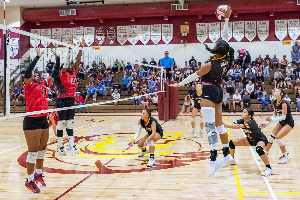 Pahrump Valley Heavenly Ware (1) hits the ball over the net over to the Mater Academy East Las ...