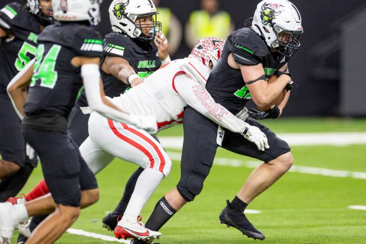 SLAM Academy senior Dylan Tondreau, right, runs with an intercepted ball during the Class 3A fo ...