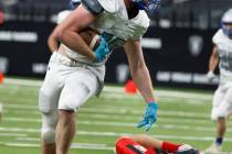 Pahranagat Valley tight end Boogie Lewis (19) runs for a touchdown as Tonopah defensive back Dr ...