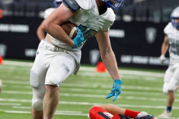 Pahranagat Valley tight end Boogie Lewis (19) runs for a touchdown as Tonopah defensive back Dr ...