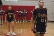 Heaven Cooper (13) (right) is about to shoot her free-throws against Sports Leadership & Ma ...