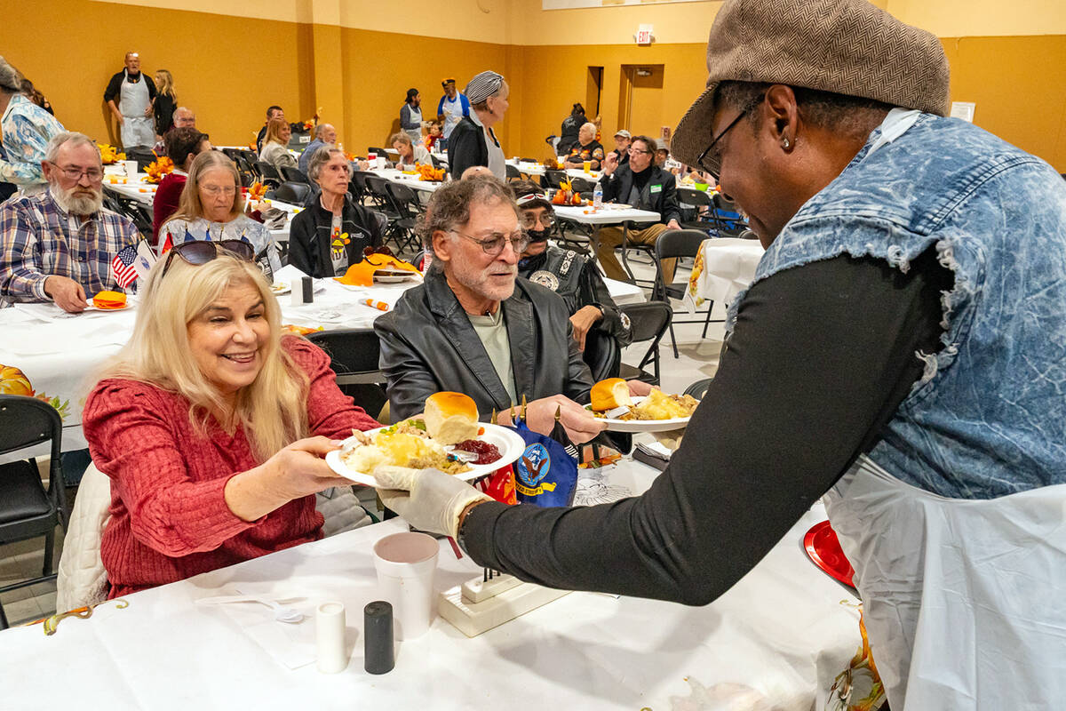 John Clausen/Pahrump Valley Times Tasty plates piled with Thanksgiving goodness were delivered ...