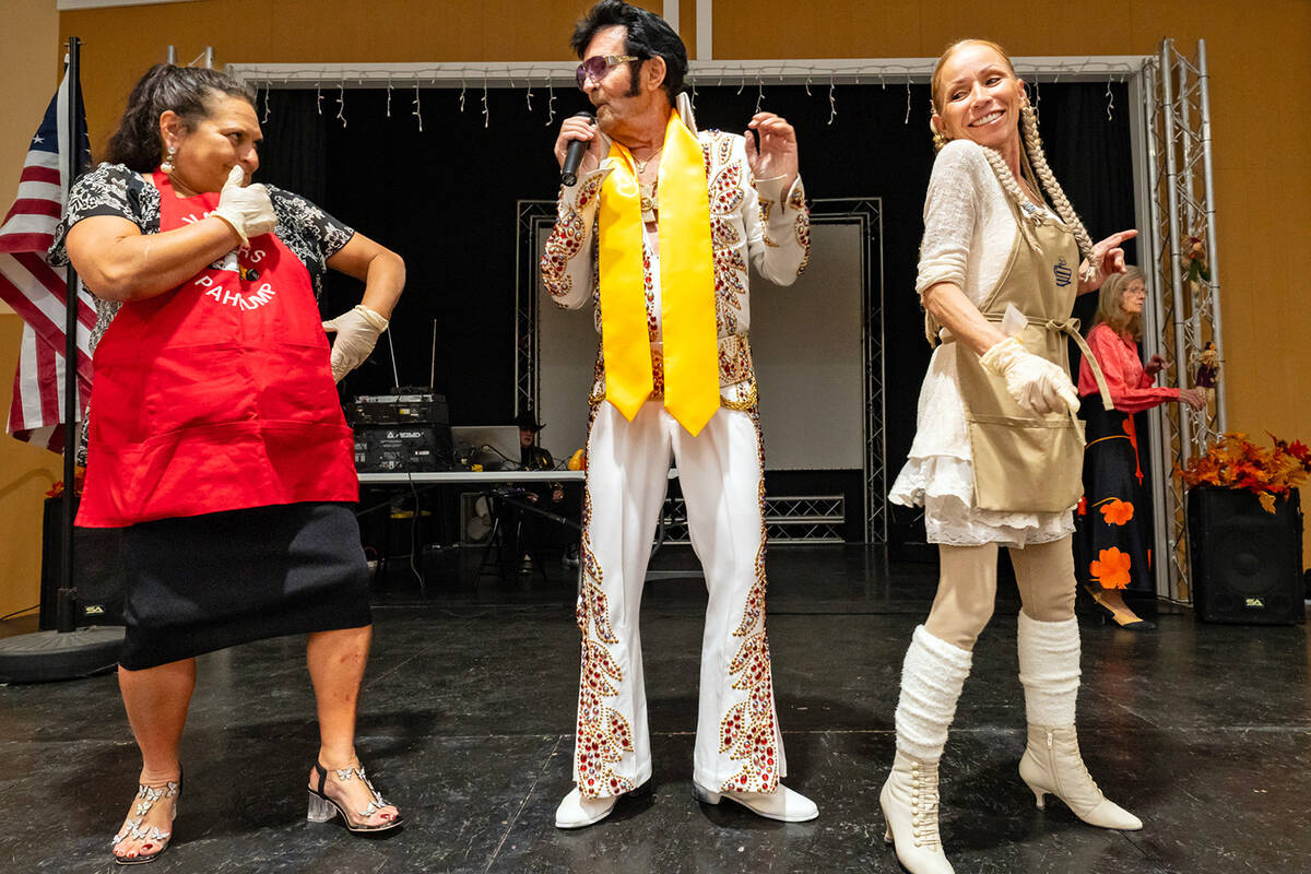 John Clausen/Pahrump Valley Times Local Elvis impersonator Johnny V, center, had people up on t ...