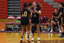 Pahrump Valley’s (center) senior Trinity French (14) (center) greets Natalie Soto (10) ( ...