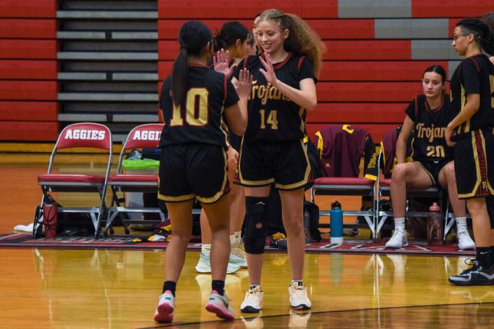 Pahrump Valley’s (center) senior Trinity French (14) (center) greets Natalie Soto (10) ( ...