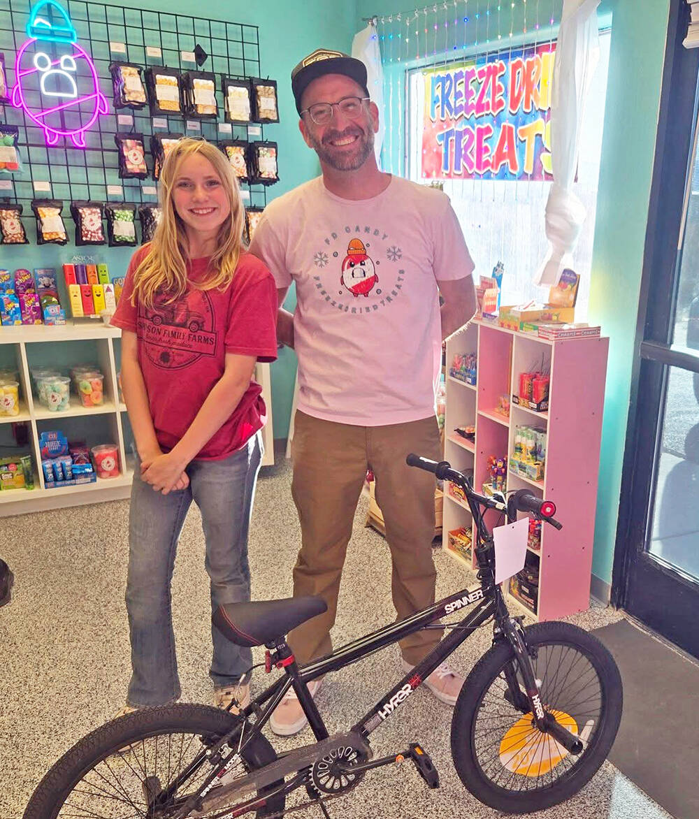 The Avery Project Avery Sampson poses with a representative of the FD Candy Company following a ...