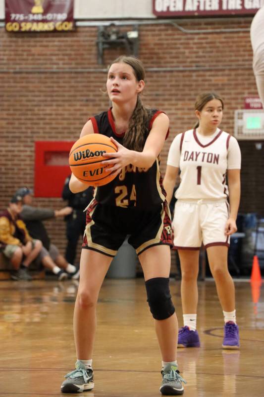 Trojans' freshman Ella Odegard (24) set up to shoot her free throw to shots against the Dayton ...