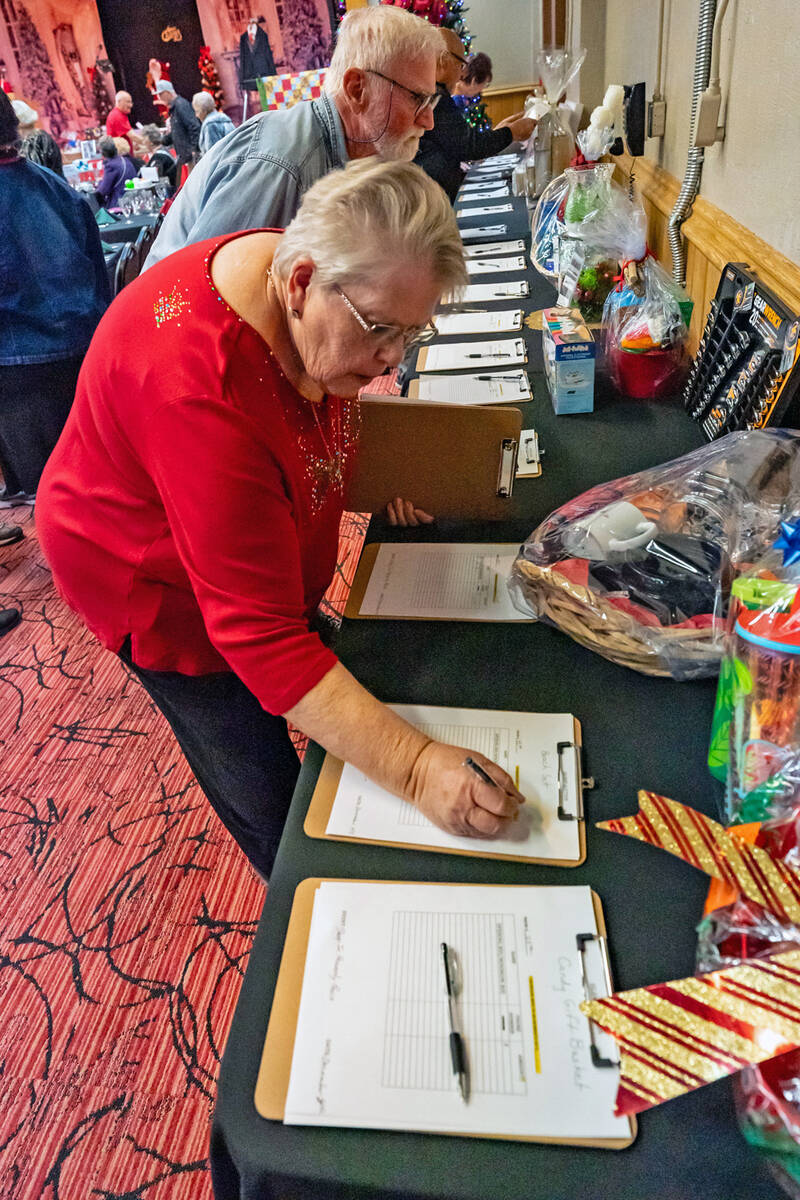 John Clausen/Pahrump Valley Times The silent auction tables saw plenty of action at the Sleep i ...