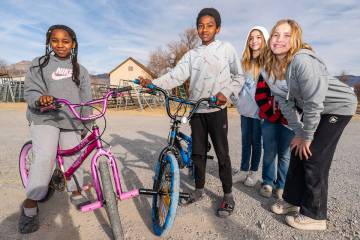 John Clausen/Pahrump Valley Times Two local youth pose with their brand new bicycles at The Ave ...