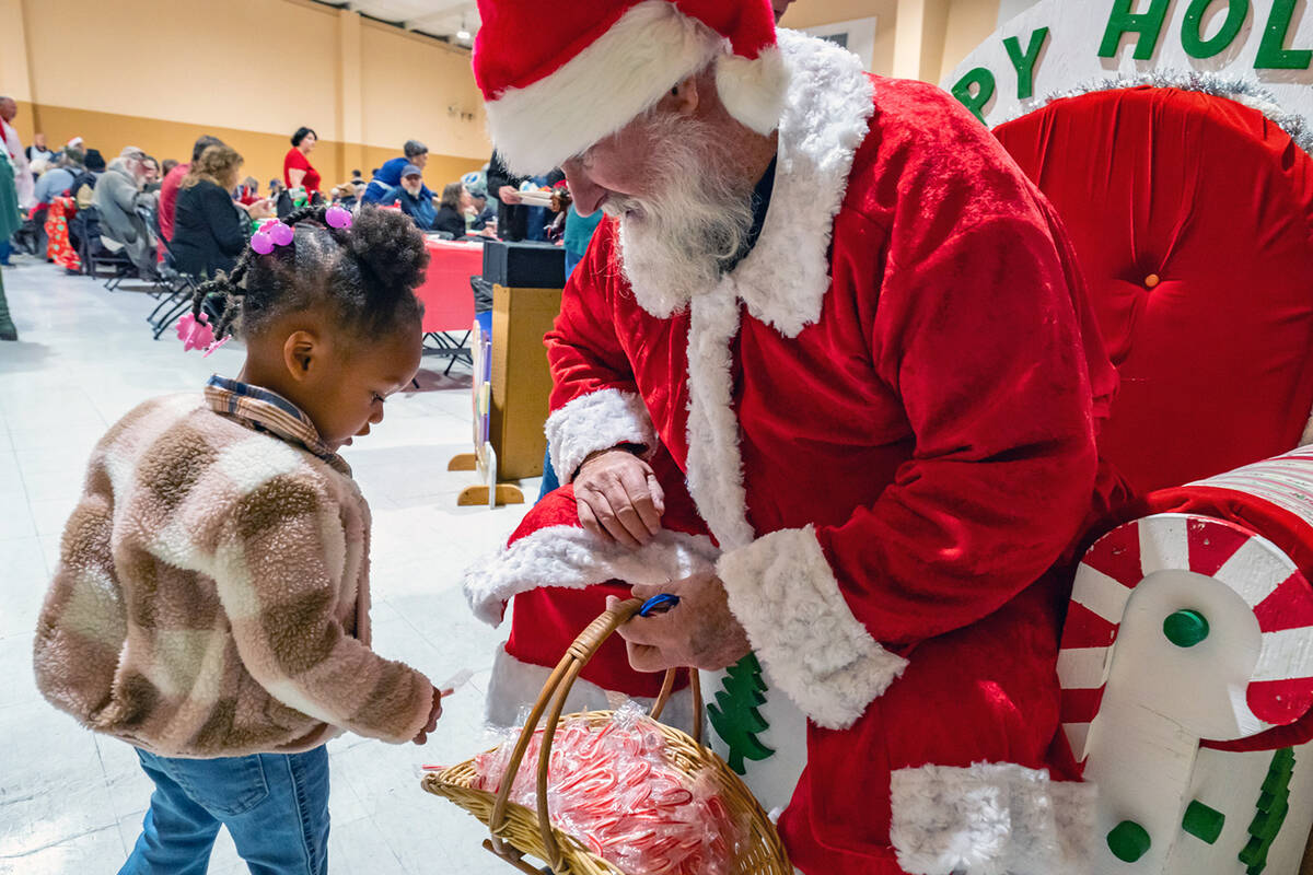 John Clausen/Pahrump Valley Times Santa Claus was on hand at the Community Christmas Dinner to ...