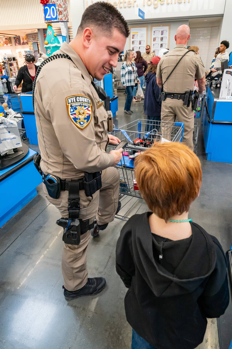 John Clausen/Pahrump Valley Times A special checkout line for deputies and their assigned kids, ...