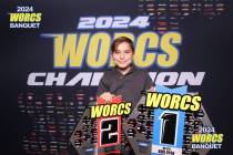 Kroi Ryan holds his first- and second-place trophies after racing in two different 90cc stock c ...