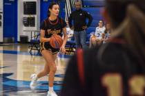 Trojans’ Riley Saldana (20) dribbles the ball towards the Coral Academy Falcons side of ...