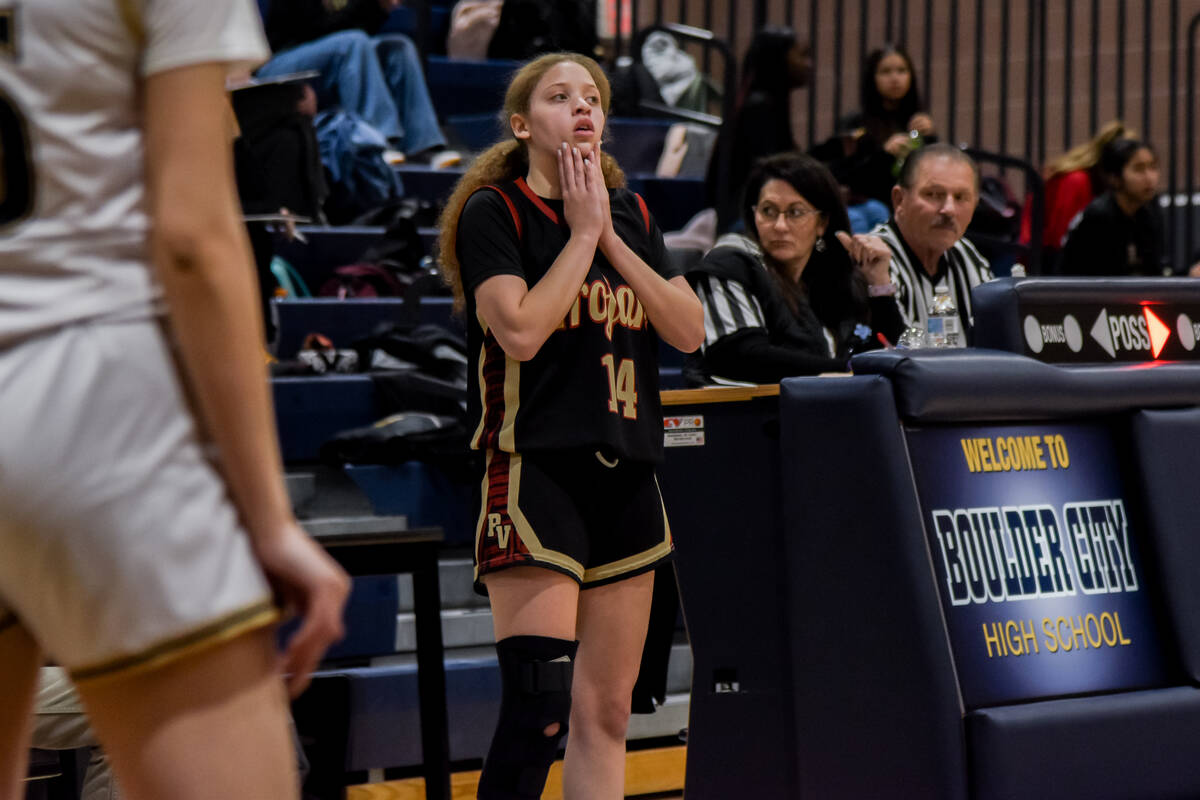 Trojans senior Trinity French (14) prepares to pass the ball to her teammates against Boulder C ...