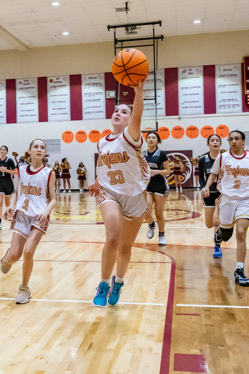 Trojans sophomore Sydney Crotty (33) attempts to secure the ball in the Pinecrest Academy Sloan ...