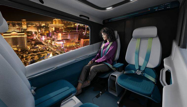 A rendering of a passenger using an air taxi aircraft in the skies over Las Vegas. (Courtesy La ...