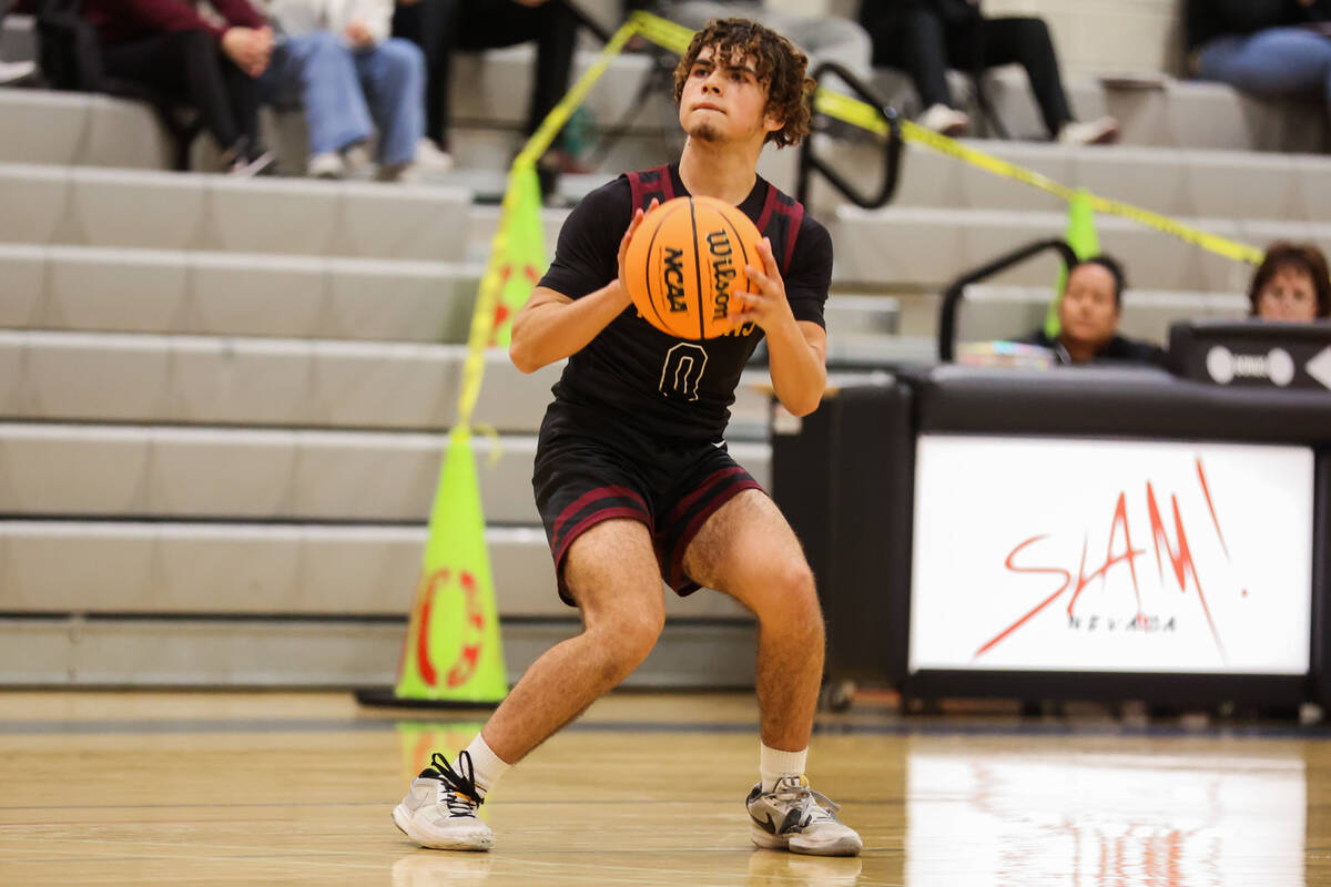 Pahrump Valley guard Alejandro Lozano attempts a shot during a basketball game between Pahrump ...