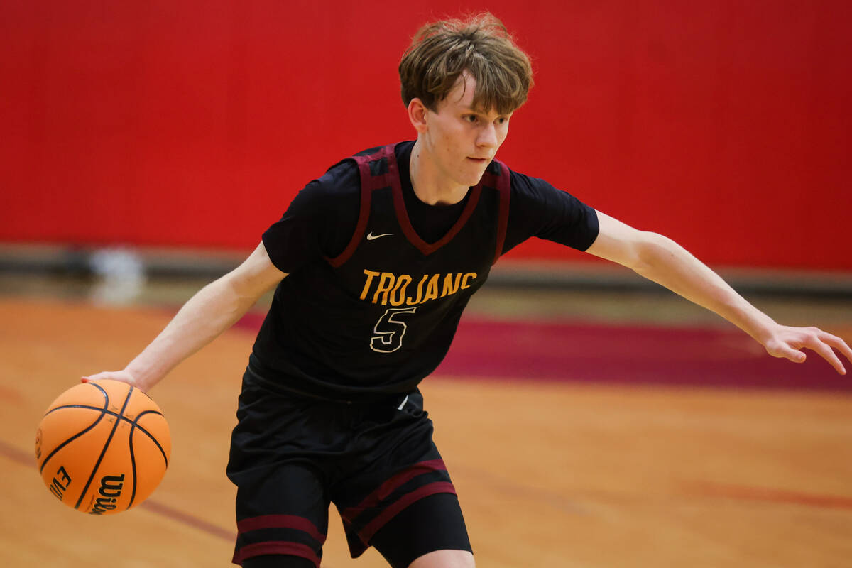 Pahrump Valley point guard Jack Toth dribbles the ball during a basketball game between Pahrump ...