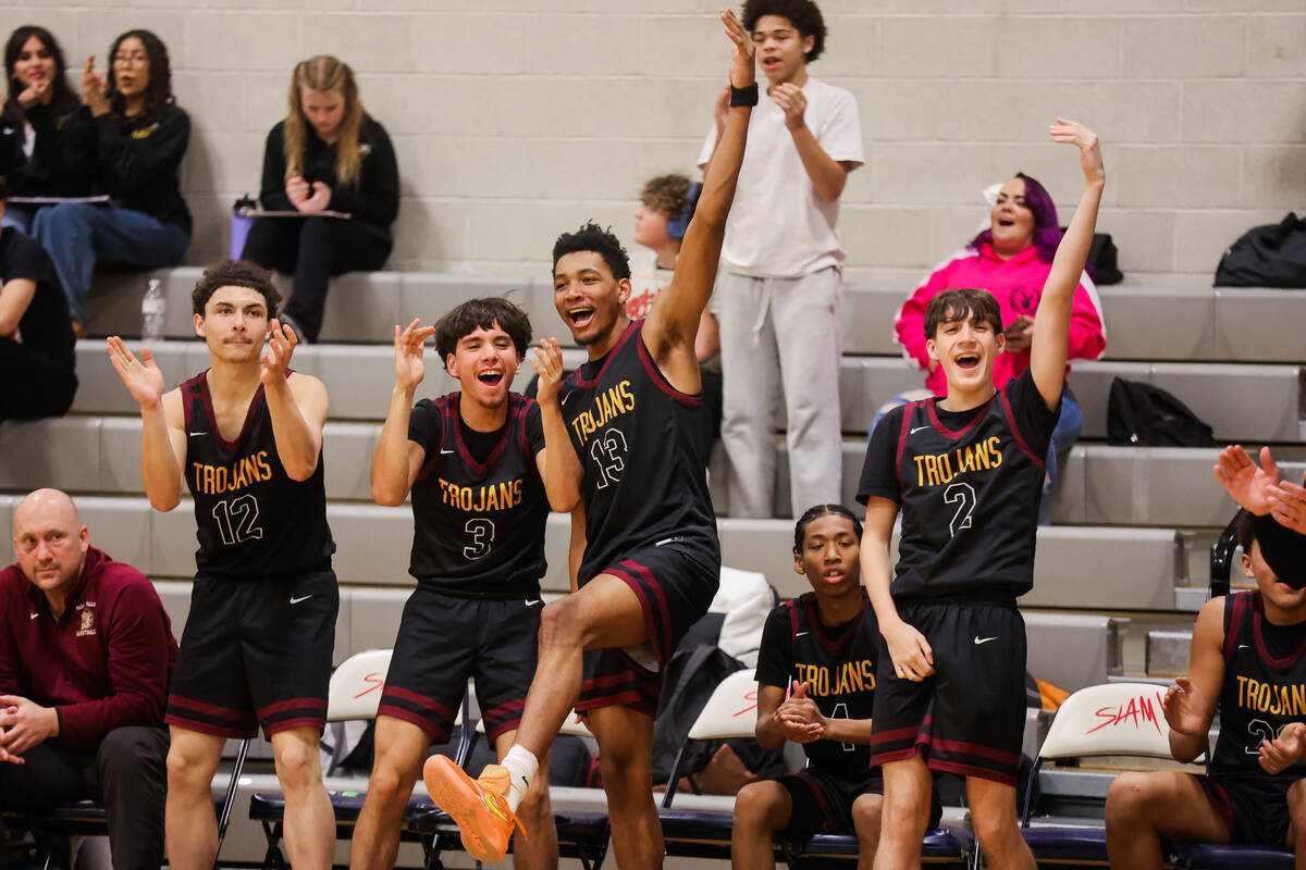 Pahrump Valley players cheer from the bench during a basketball game between Pahrump Valley and ...