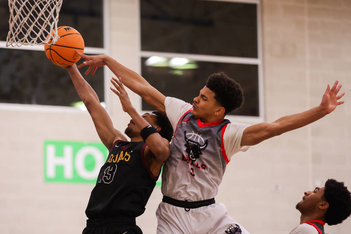 Pahrump Valley forward Tramaine Burras (13) attempts a basket during a basketball game between ...