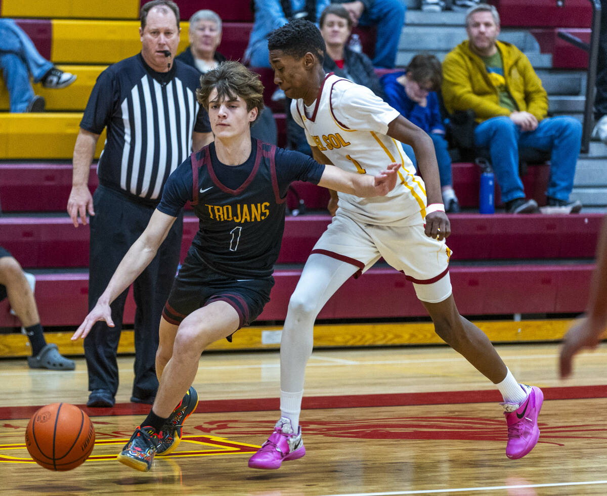 Pahrump Valley guard Keir Sheppard (1) drives the lane past Del Sol guard Jaeden Alexander (1) ...