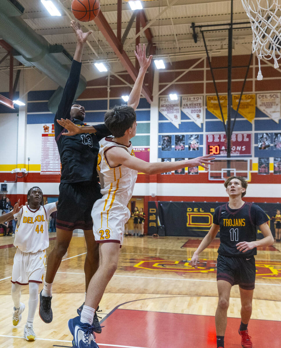 Pahrump Valley forward Tramaine Burras (13) shots over Del Sol center William Philips (23) as f ...