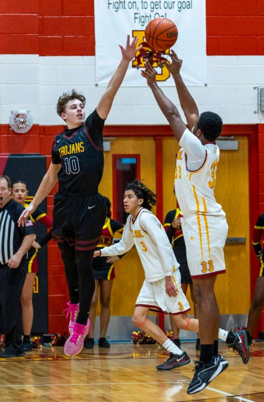 Pahrump Valley forward Lucas Gavenda (10) looks to interrupt o shot by Del Sol forward James He ...