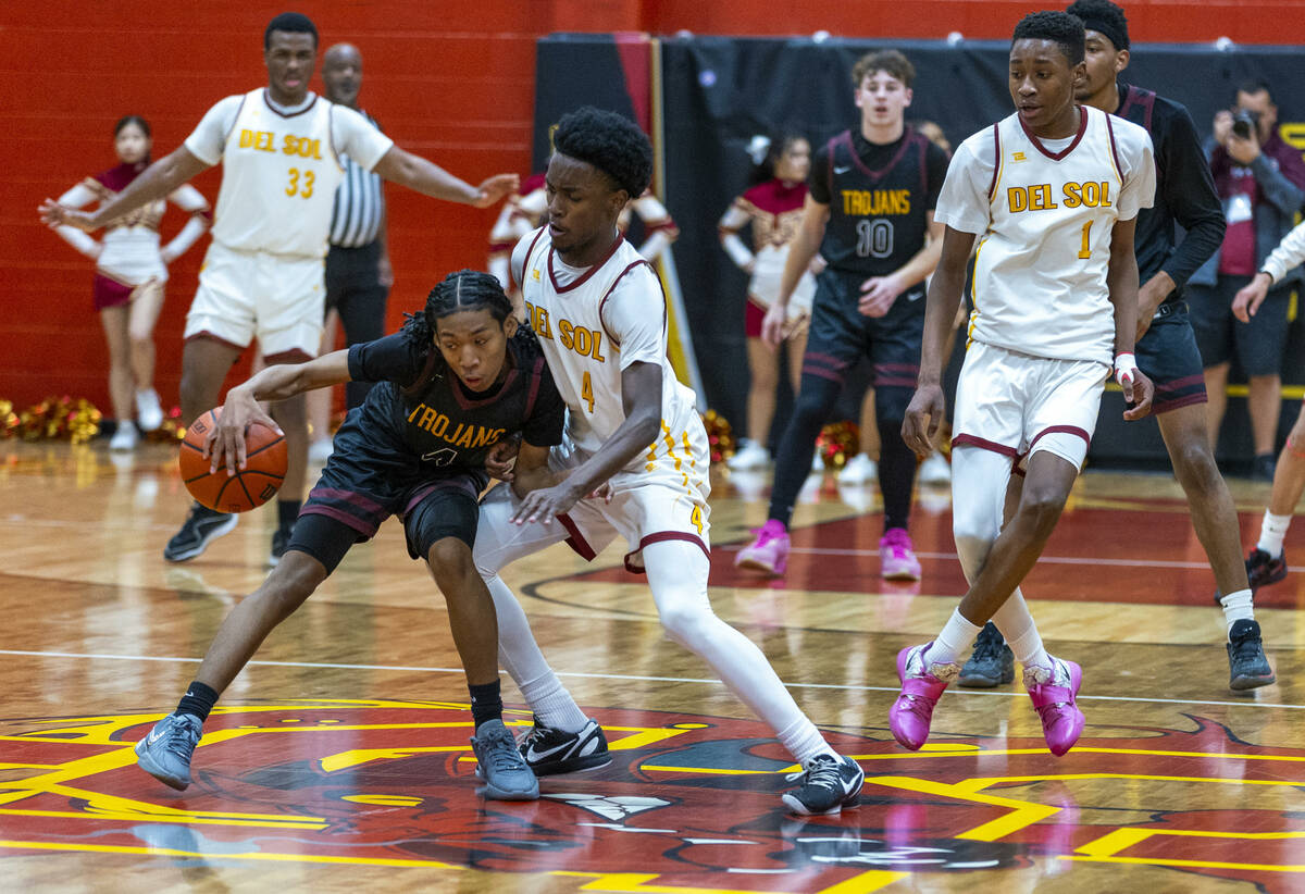 Pahrump Valley guard Cartier Jenkins (4) handles the ball against Del Sol guard Kelly Dawson (4 ...