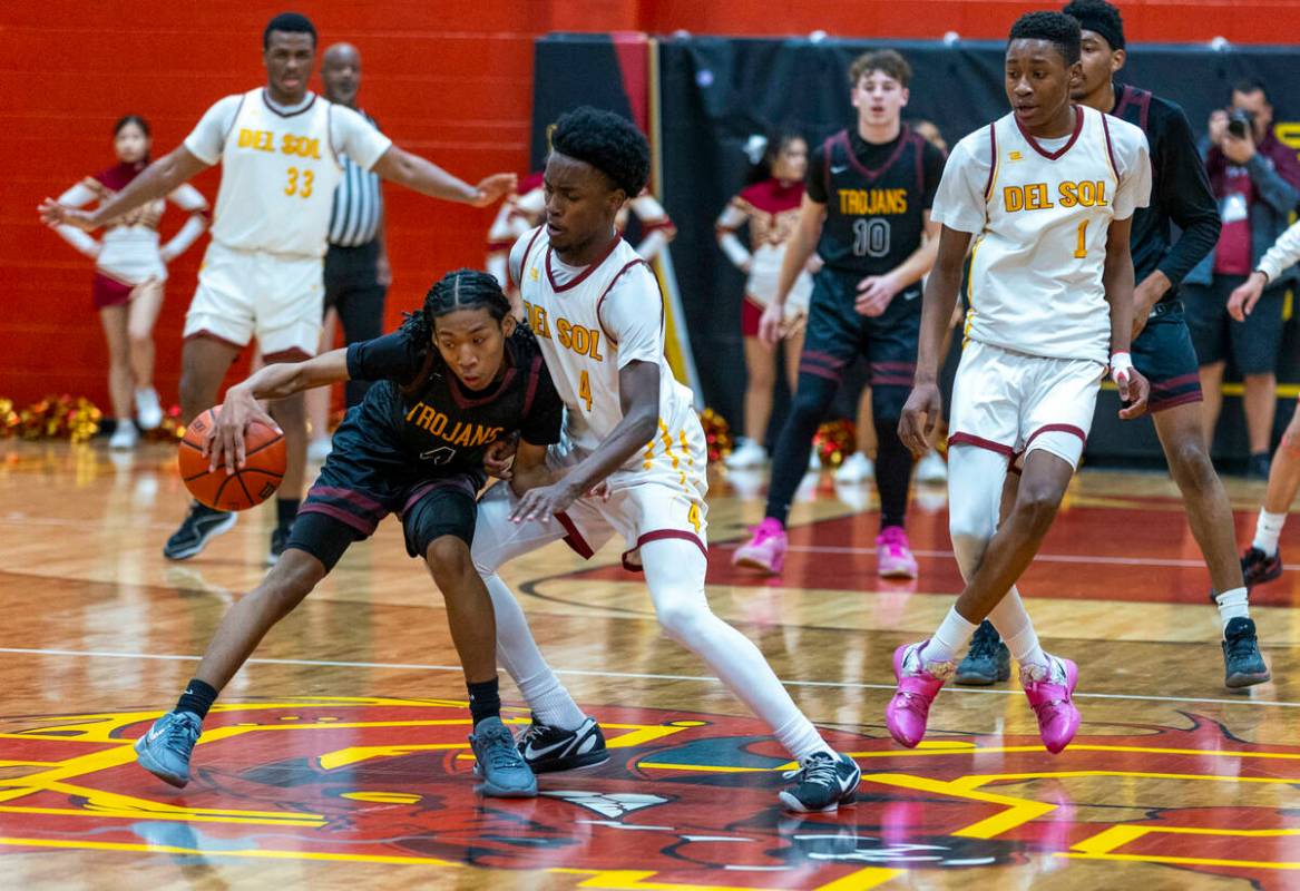 Pahrump Valley guard Cartier Jenkins (4) handles the ball against Del Sol guard Kelly Dawson (4 ...