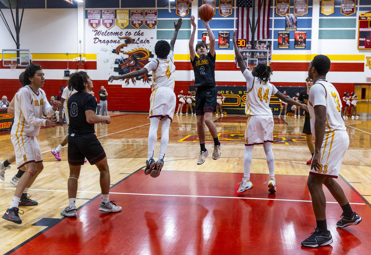 Pahrump Valley guard Caden Briscoe (2) posts up for a shot between Del Sol guard Kelly Dawson ( ...