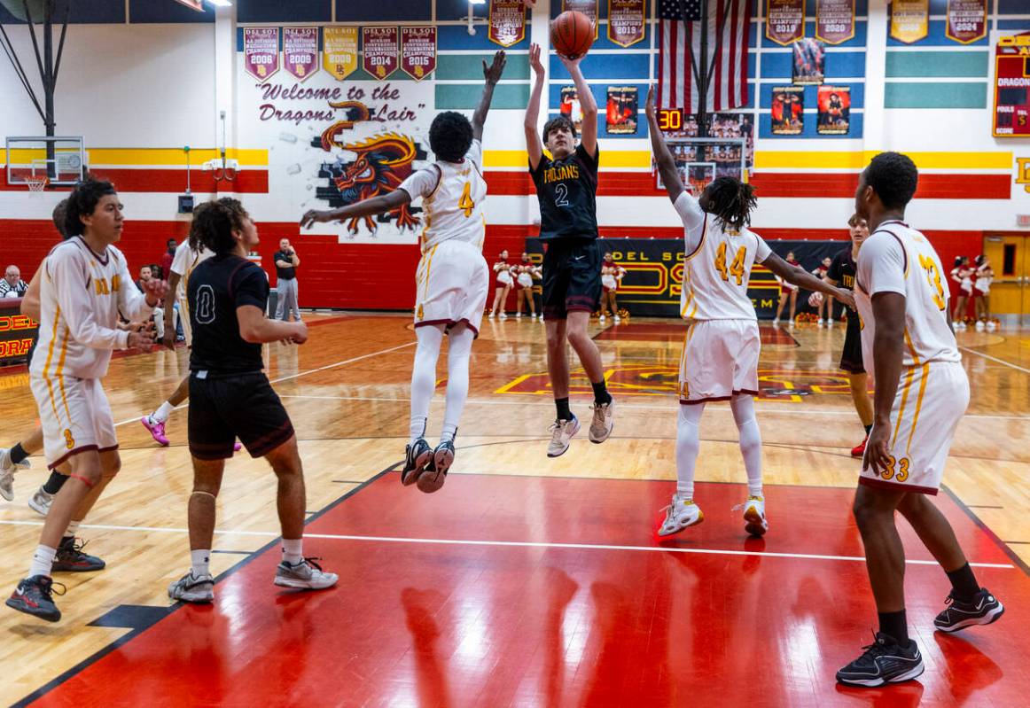 Pahrump Valley guard Caden Briscoe (2) posts up for a shot between Del Sol guard Kelly Dawson ( ...