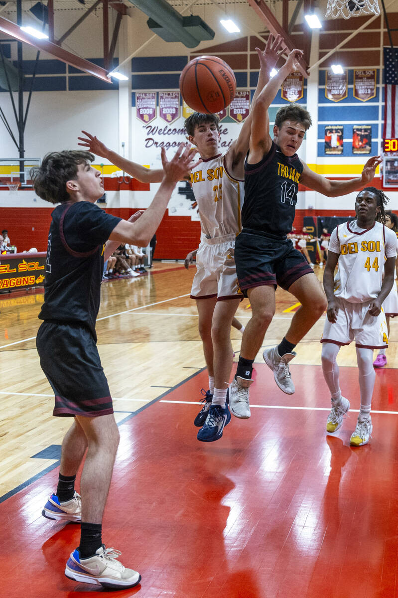 Pahrump Valley guard Caden Briscoe (2) looks to secure a loose ball created by Del Sol center W ...