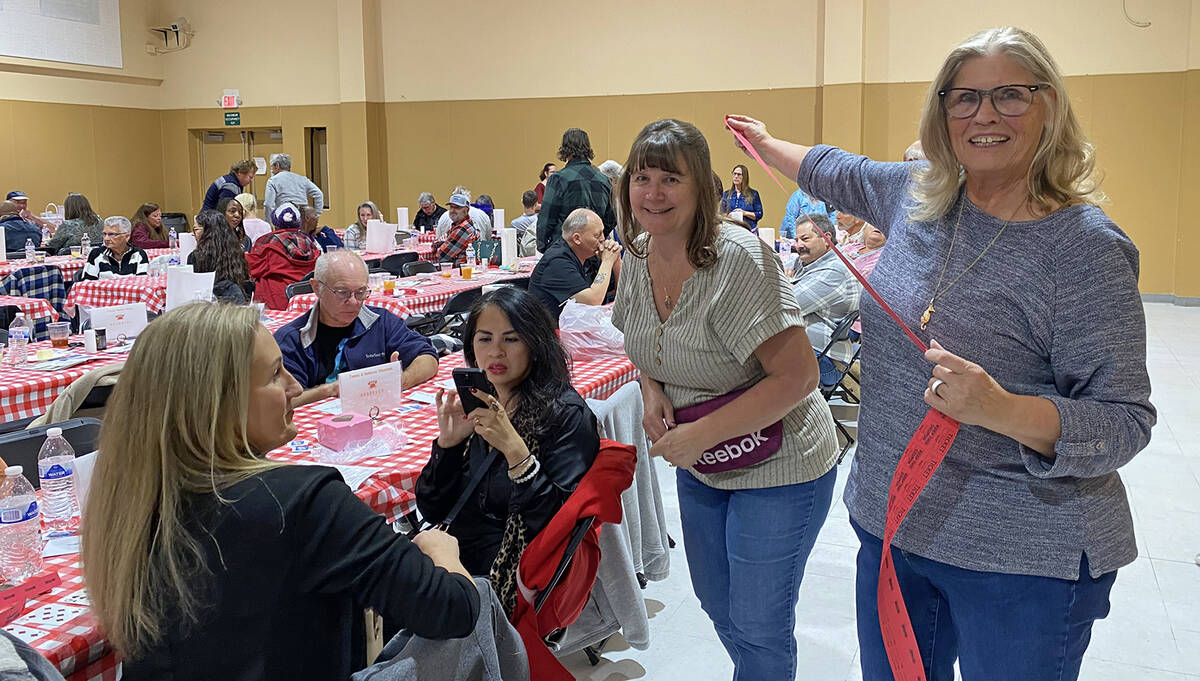 Robin Hebrock/Pahrump Valley Times With a big grin, Rebecca Oscarson pulls out an arm's length ...