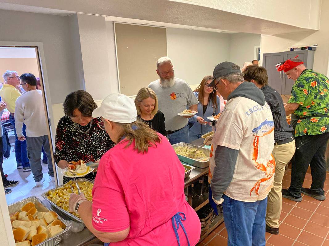 Robin Hebrock/Pahrump Valley Times The buffet line at ACORN's Crab Fest featured hundreds of po ...