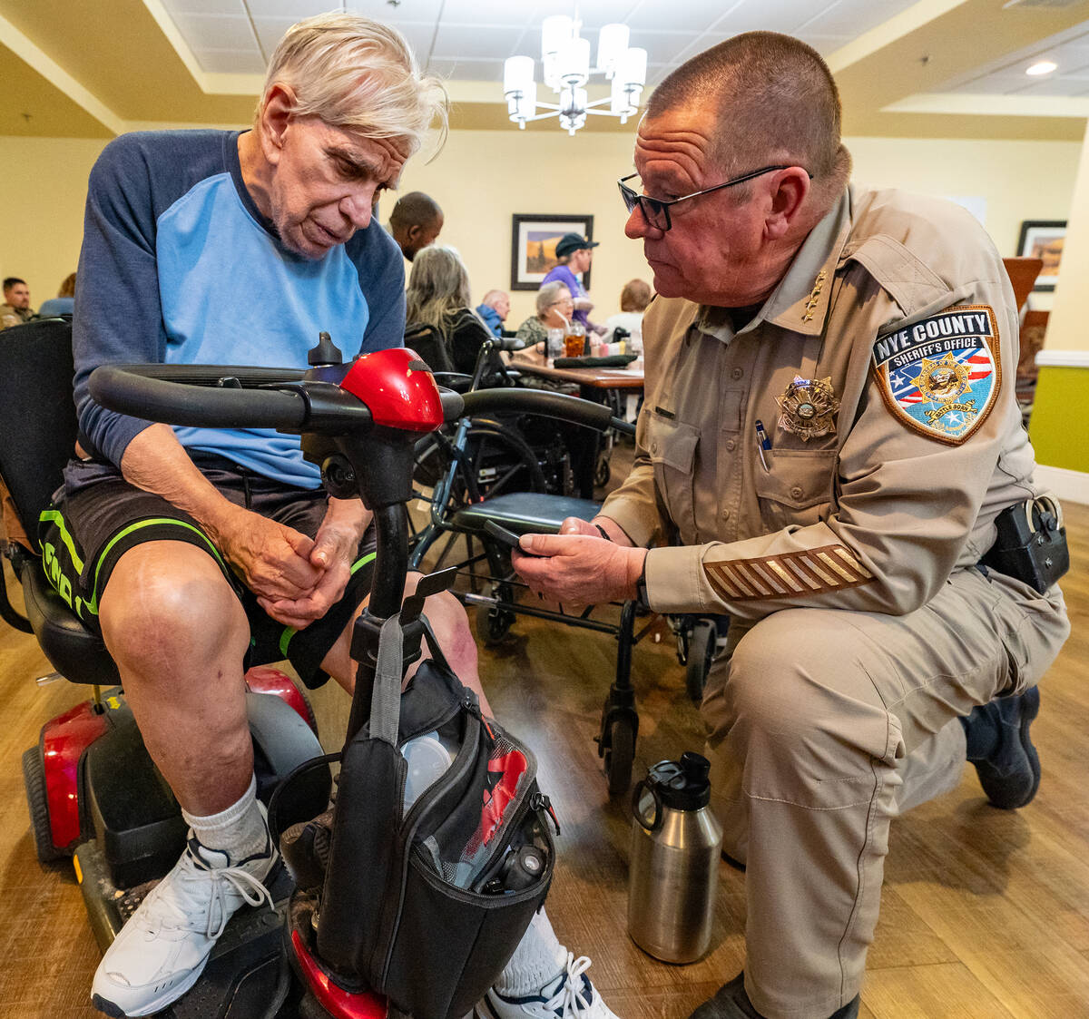 John Clausen/Pahrump Valley Times Nye County Sheriff Joe McGill talks with an Inspirations resi ...